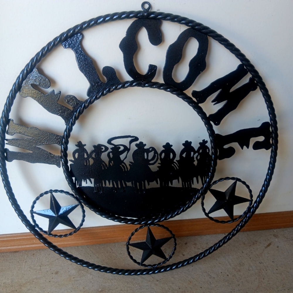 Twisted metal cowboy welcome sign.